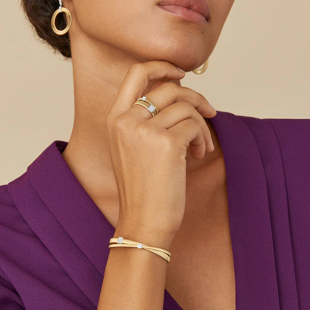 Woman wearing gold and diamond bracelet