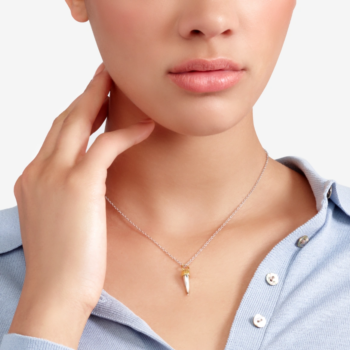 horn pendant in sterling silver with 9kt yellow gold detail from dodo italian designer jewellery