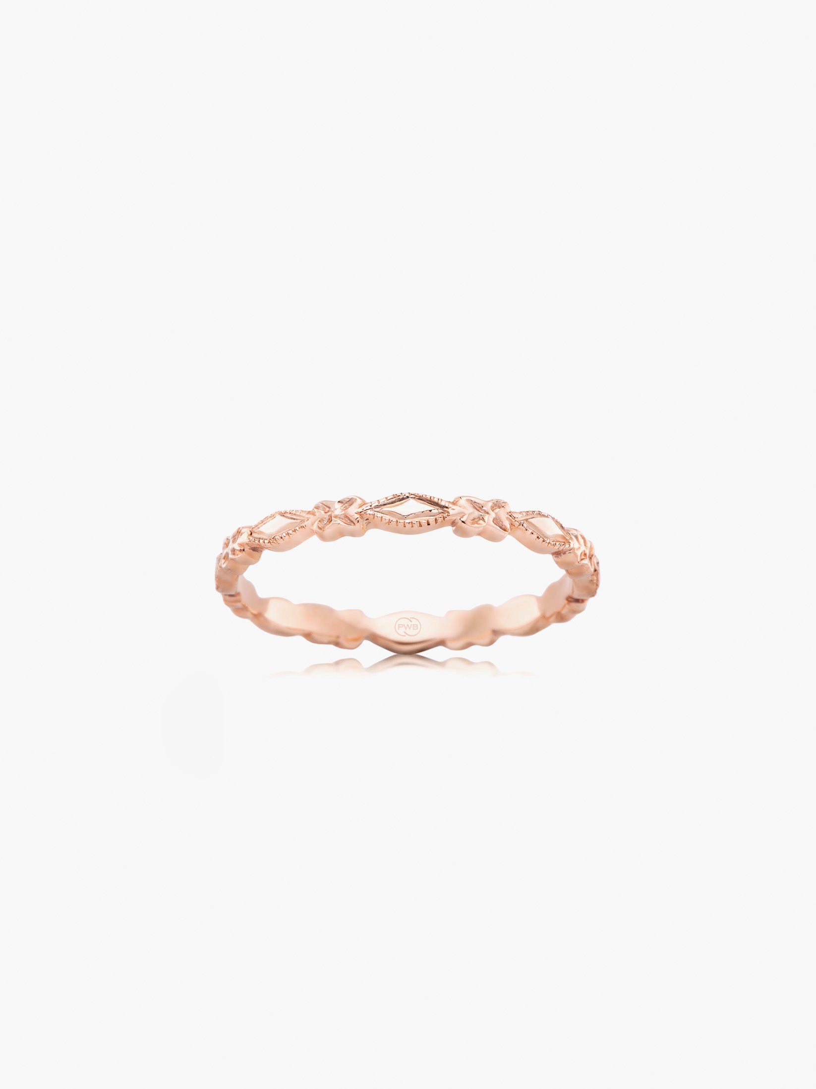 Rose Gold Ring. This fine patterned wedding band features delicate engraved detailing that adds subtle texture to a timeless design. Available in a selection of precious metals, it offers a refined and personal expression of commitment.