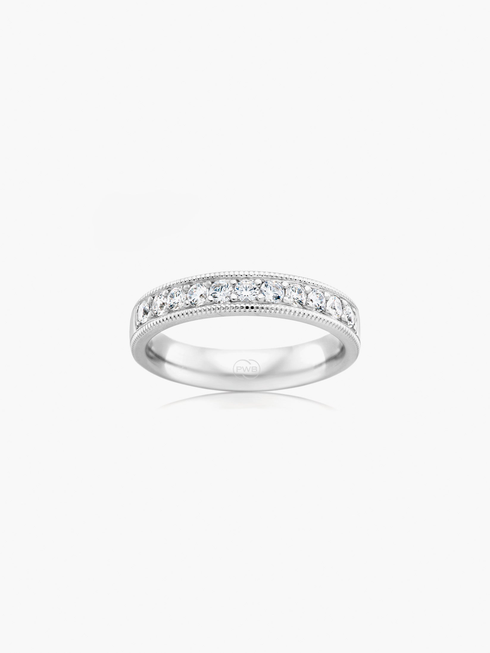 This milgrain diamond wedding ring in white gold combines refined brilliance with delicate vintage-inspired detailing. Each Orsini wedding ring is crafted to order, allowing you to personalise the design in your preferred metal, width, thickness, and finger size.