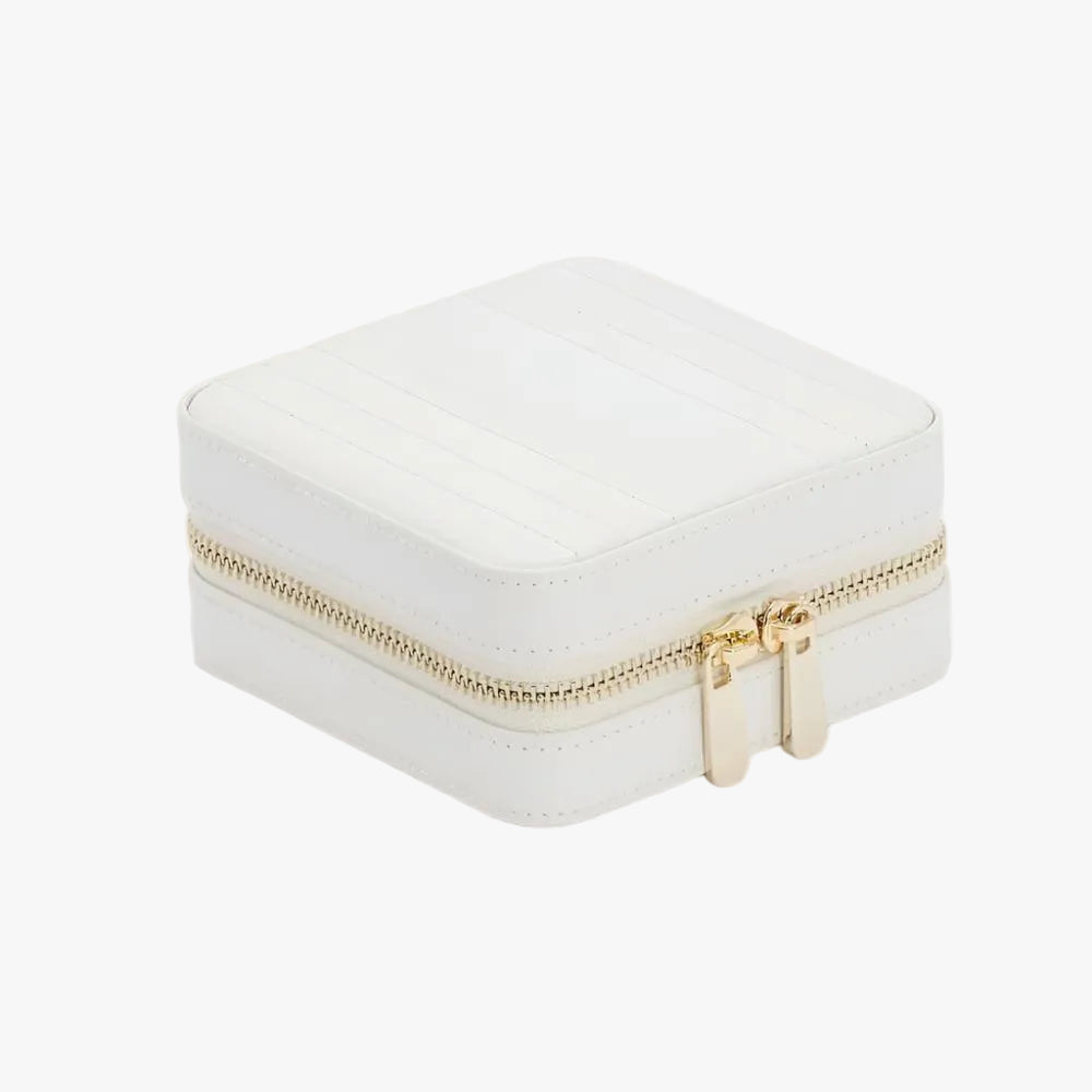 The WOLF Maria Small Zip Jewellery Travel Case in White is crafted from smooth leather with elegant gold-tone accents and a patented LusterLoc™ lining that helps protect jewellery from tarnishing for up to 35 years.