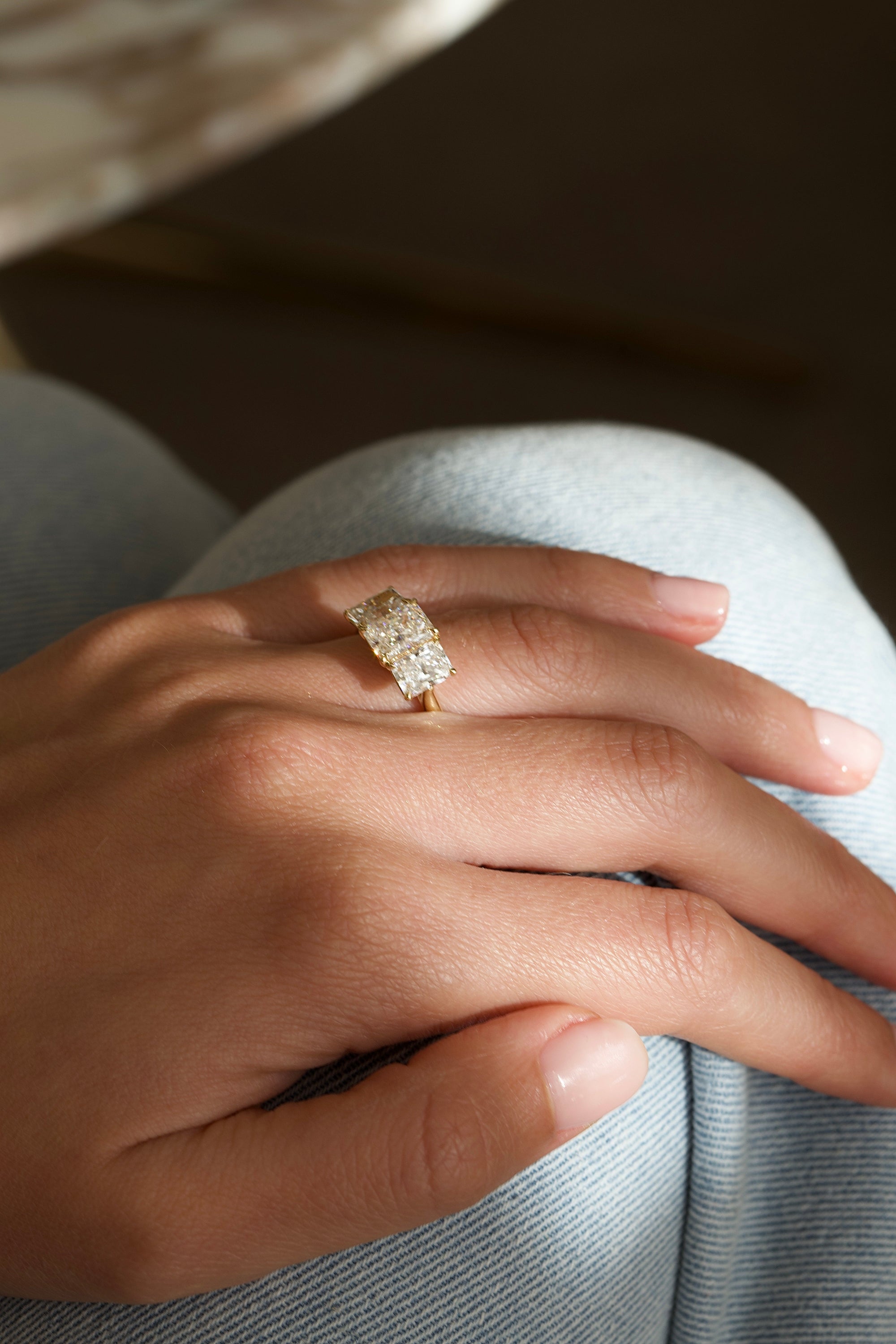 Loggia three stone radiant cut diamond engagement ring worn on hand | Orsini