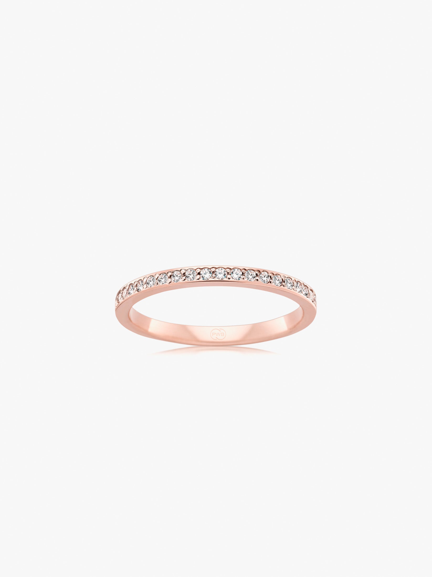 This slim bead set diamond wedding ring in rose gold combines warm tone with delicate diamond brilliance. Each Orsini wedding ring is crafted to order, allowing you to personalise the design in your preferred metal, width, thickness, and finger size.