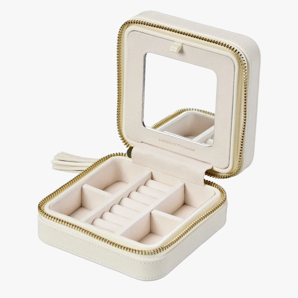 WOLF Lauren small zip jewellery case in ivory leather with elegant storage for rings, earrings, bracelets and necklaces. Discover luxury jewellery storage at Orsini.