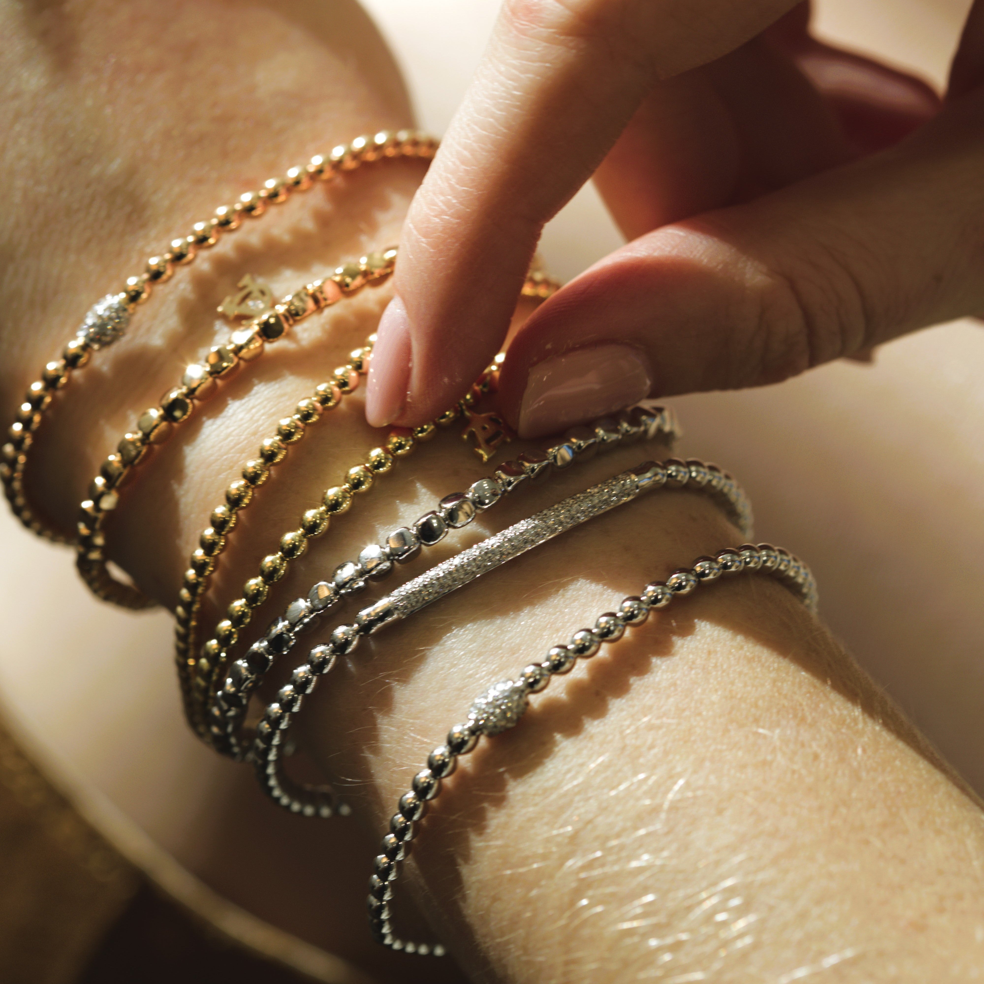 18k gold stretch bracelets from Al coro