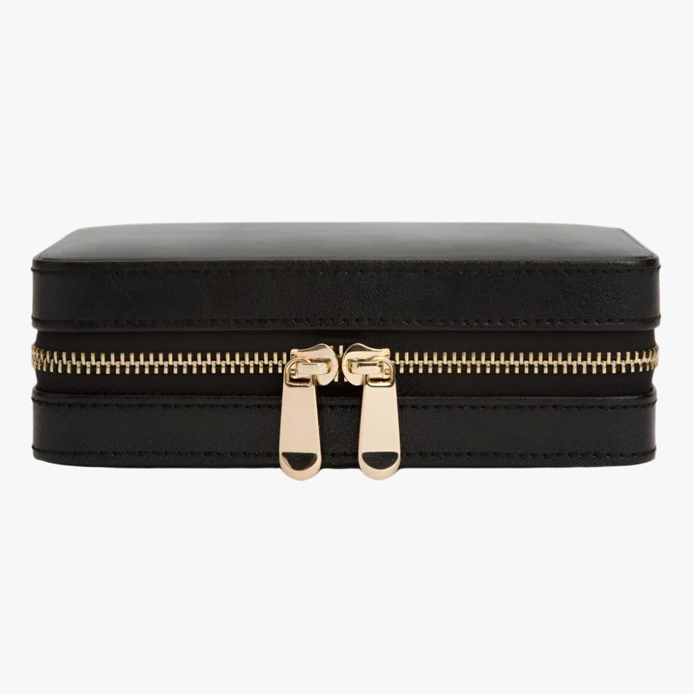 The WOLF Palermo Zip Jewellery Case in Black is crafted from luxurious pebbled leather with refined gold-tone hardware and a patented LusterLoc™ lining that helps protect jewellery from tarnishing for up to 35 years. Elegant and compact, it offers beautifully organised storage for your favourite jewellery at home or while travelling.