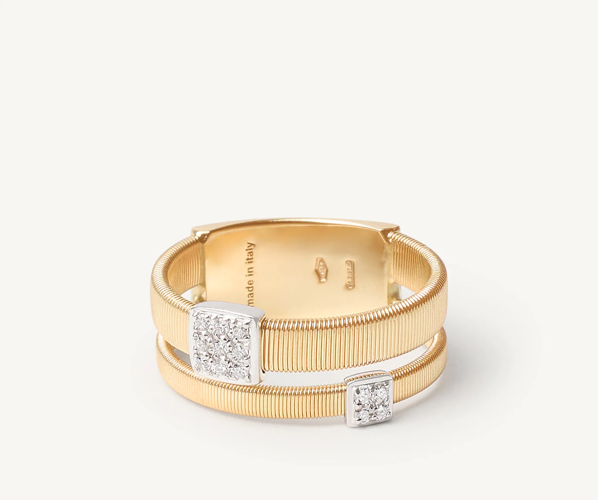 Close up of diamond pave ring set in yellow and white gold 