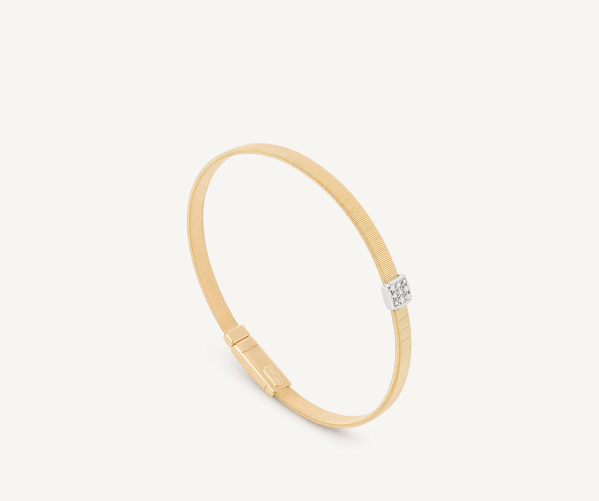 Yellow and white gold with diamonds Masai bracelet by Marco Bicego on white background