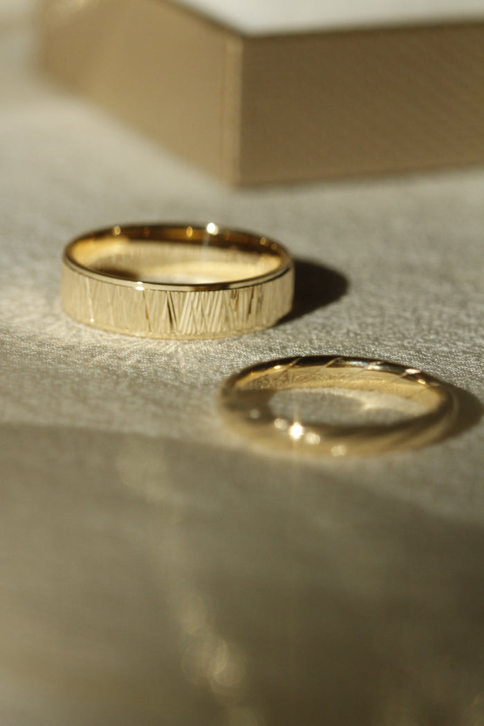 His and Her Wedding Bands in Yellow Gold with Gold Ribbon