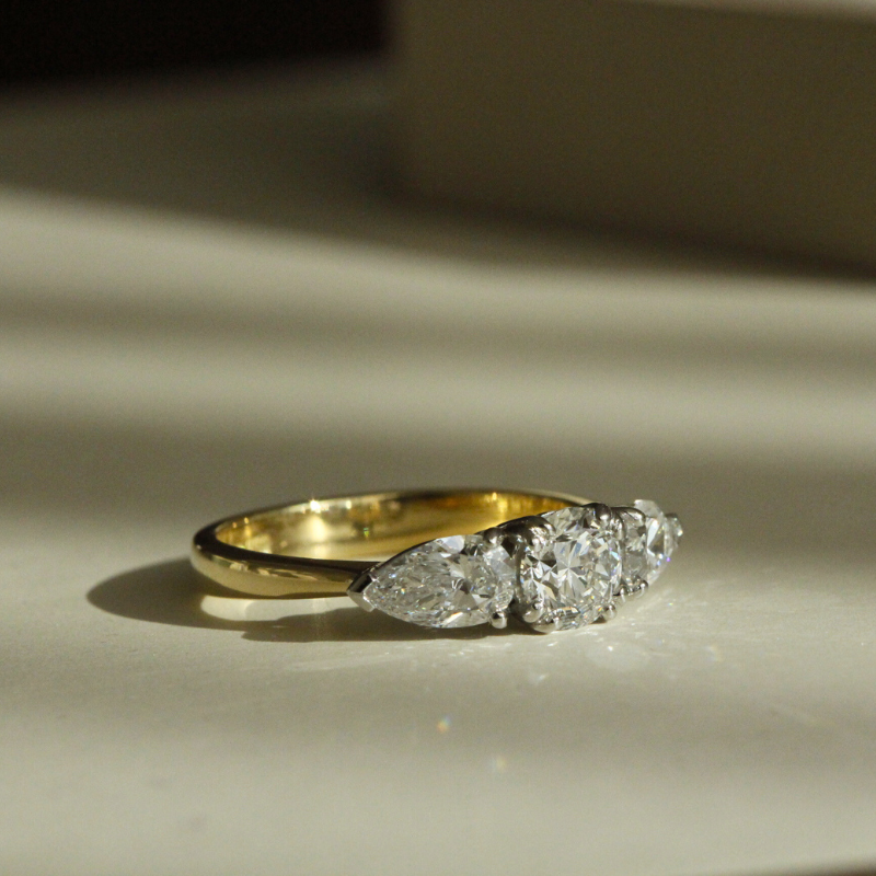 One of a kind 18k gold and platinum engagement ring with three diamonds image