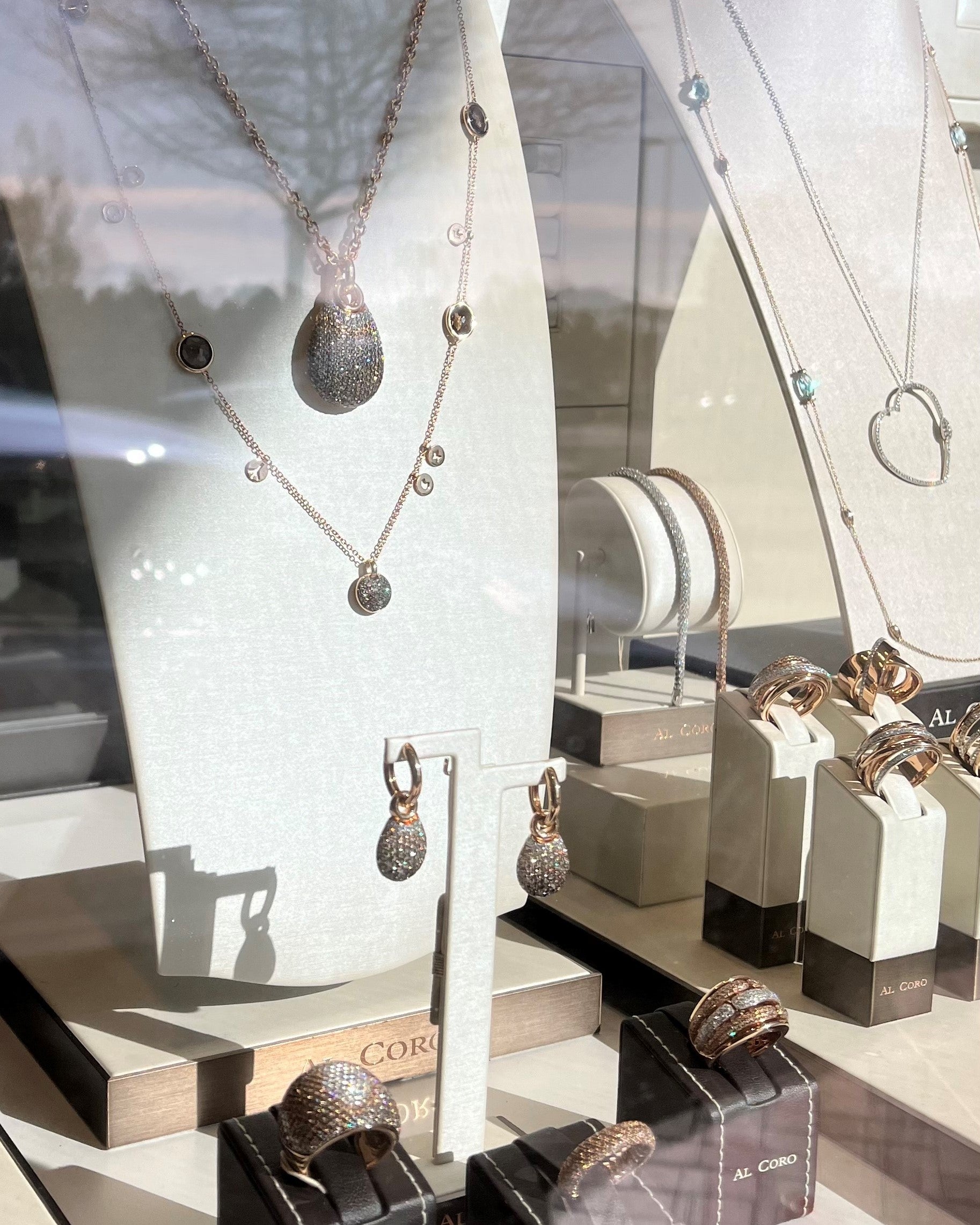 Al Coro jewellery images taken in Orsini Fine Jewellery front window display 18k rose gold and diamonds jewellery