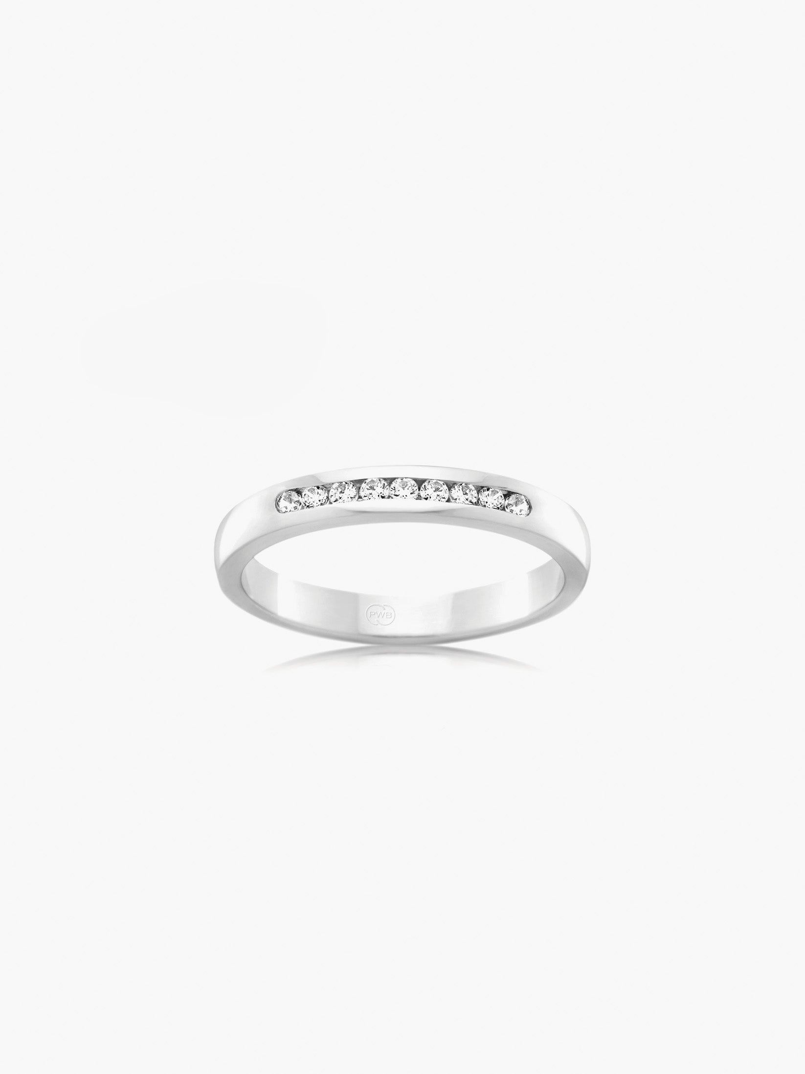 This Orsini wedding ring is crafted in 18kt white gold with a polished finish and set with nine channel set brilliant cut diamonds totalling 0.225ct. Each ring is crafted to order, allowing you to personalise the metal, width, thickness and finger size.