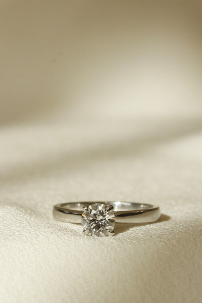 Vertical image of classic style engagement ring solitaire diamond four claw Tulipano setting 