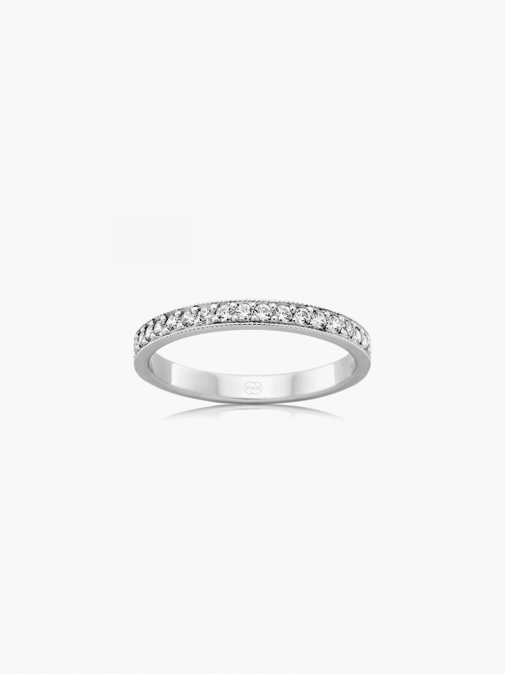 This diamond wedding ring with milgrain detailing combines delicate texture with refined brilliance, creating an elegant interpretation of a classic eternity-style band. Each Orsini wedding ring is crafted to order, allowing you to personalise the design in your preferred metal, width, thickness, and finger size.