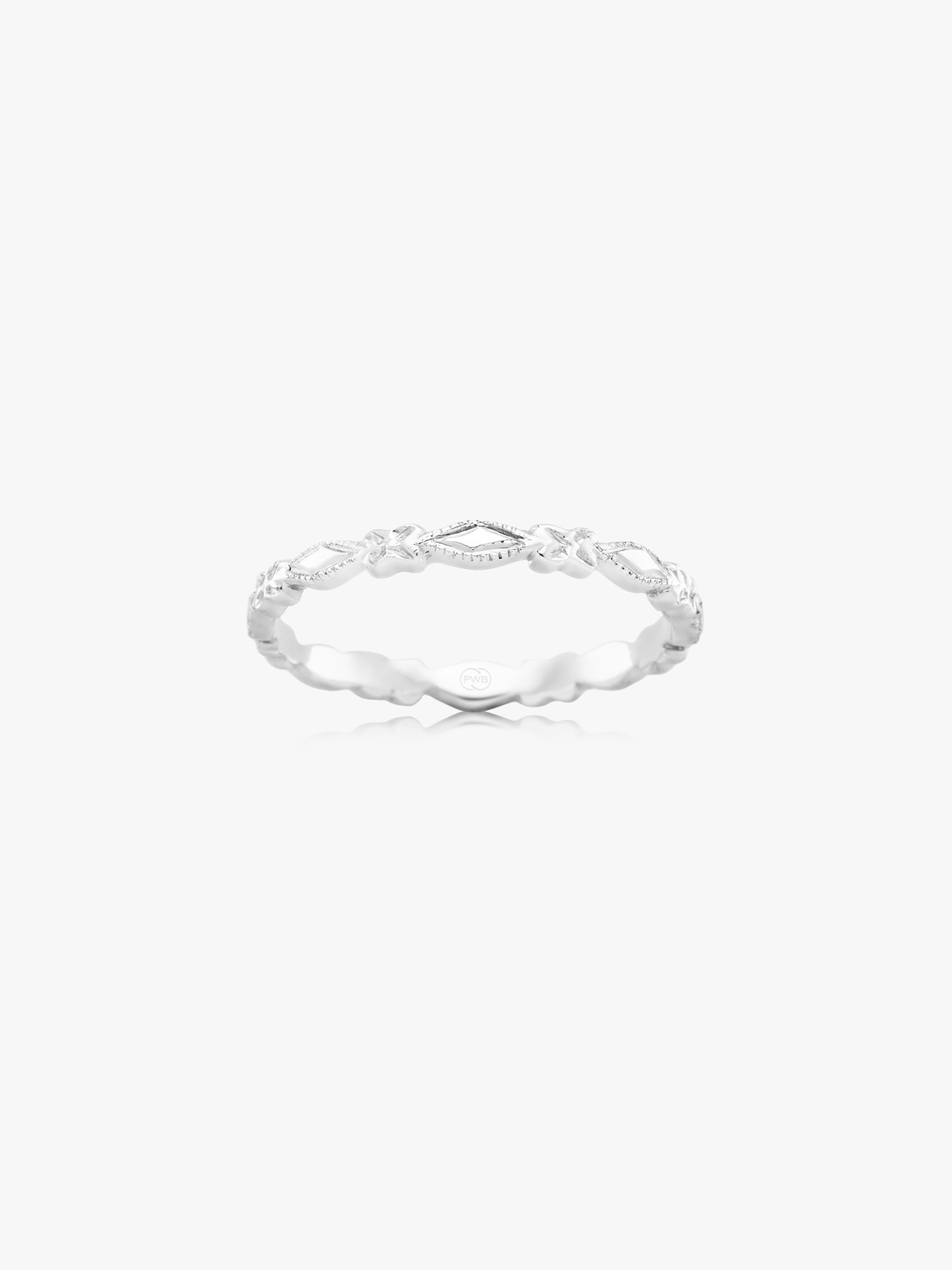 Platinum RIng. This fine patterned wedding band features delicate engraved detailing that adds subtle texture to a timeless design. Available in a selection of precious metals, it offers a refined and personal expression of commitment.