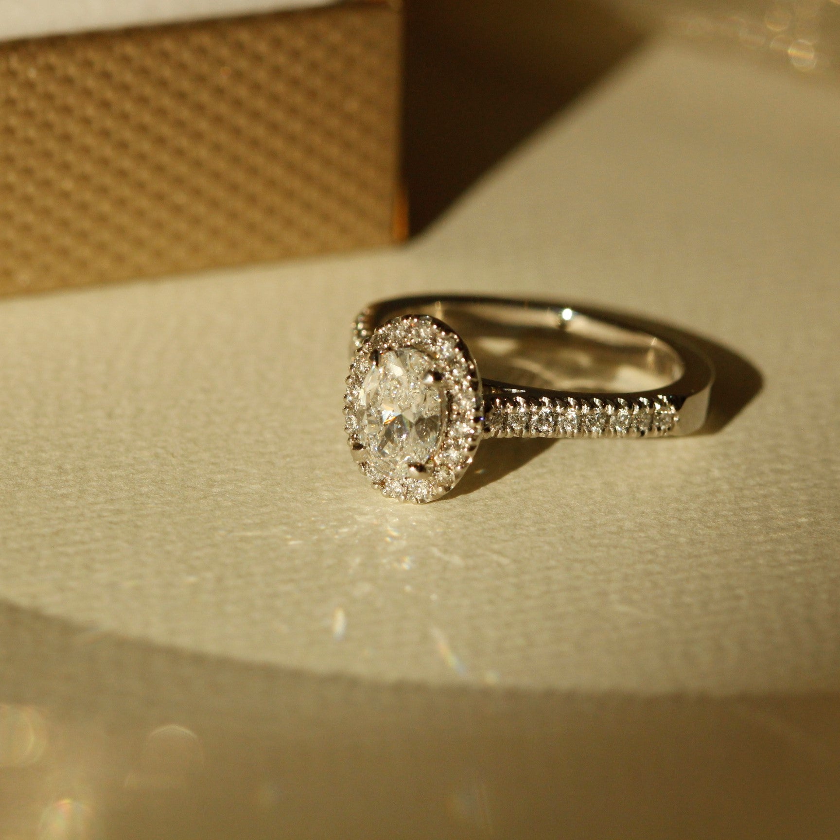 Engagement Ring Halo with Diamonds made from Platinum Le Fenice Oval Design  