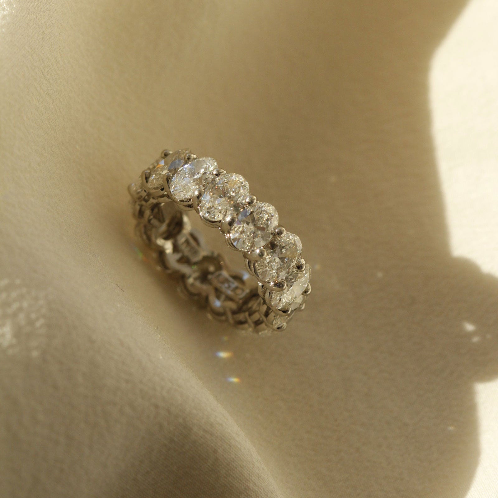 Oval diamond eternity ring made in platinum