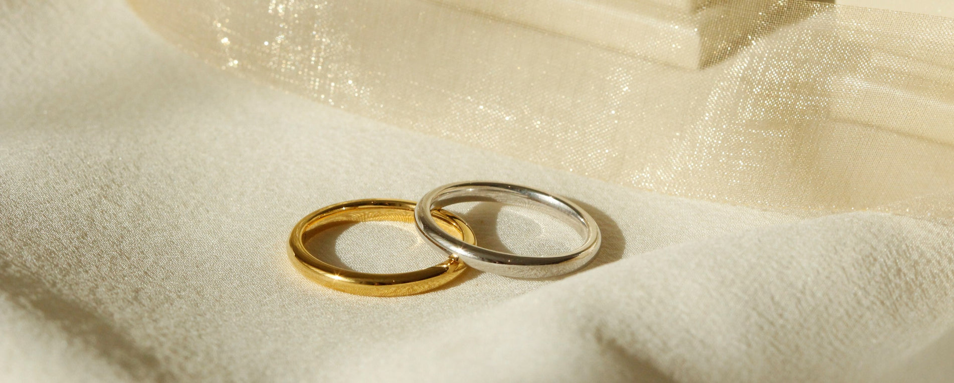 Womens wedding ring set, one in white gold and one in yellow gold in a rounded belini profile