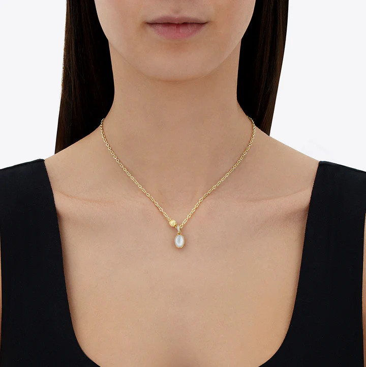Nanis Muse Boule Mother of Pearl Pendant in Gold with Diamonds (Small) on model