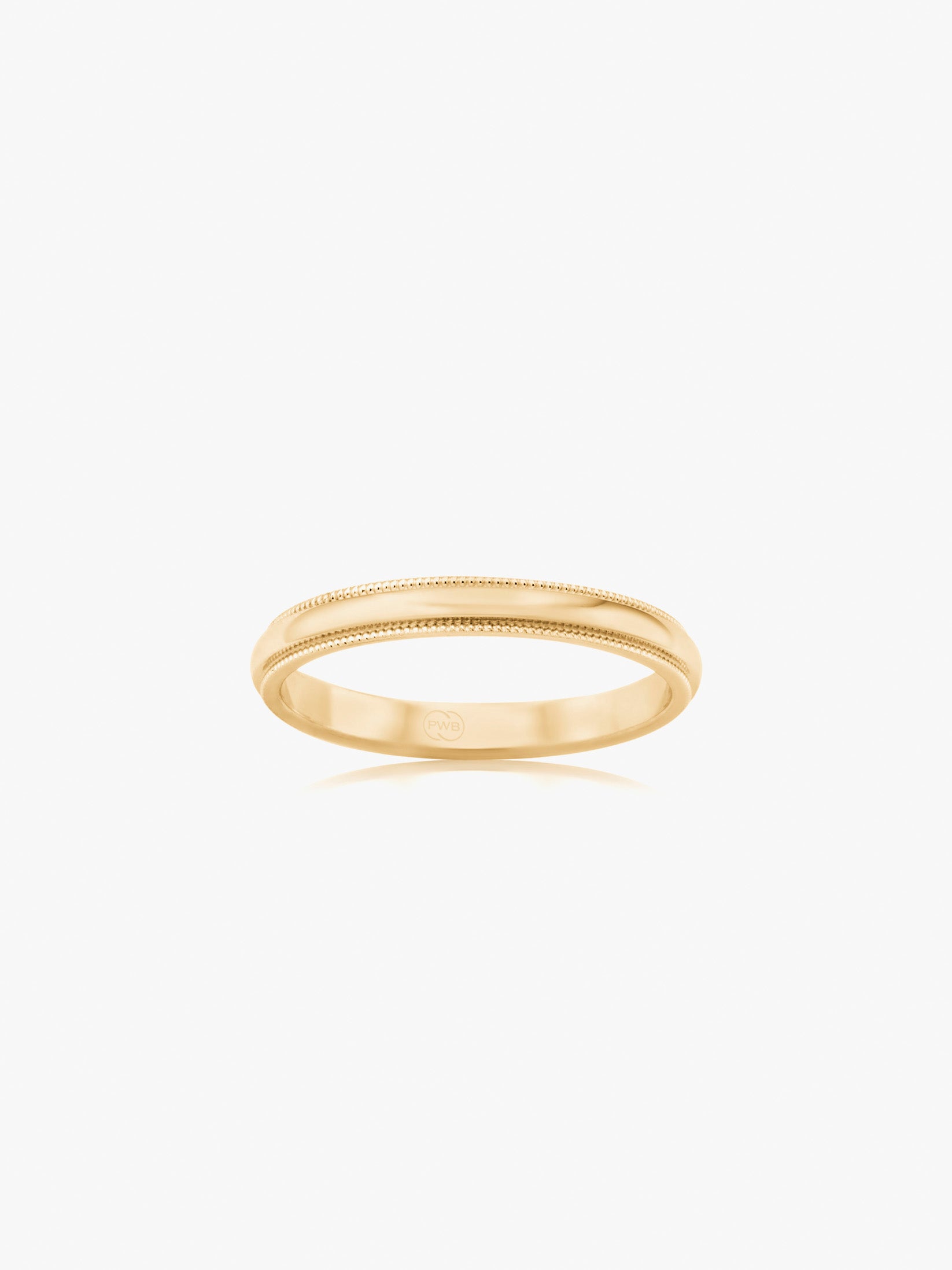 A classic yellow gold wedding ring with a softly rounded profile and delicate milgrain edge detailing.