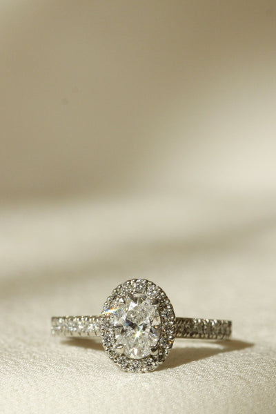 Le Fenice setting Oval centre diamond with diamond halo and diamonds on band Vertical image for mobile size 