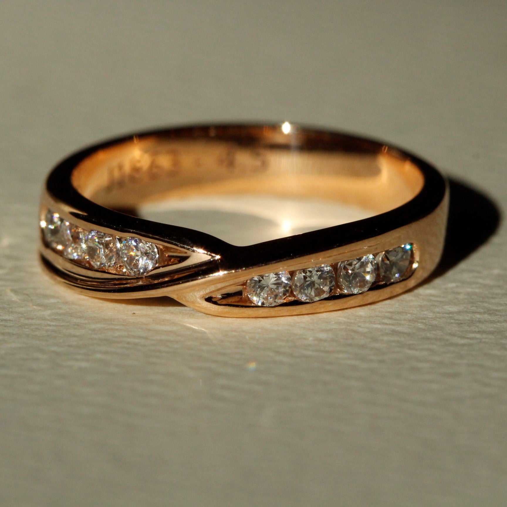 Rose gold and diamonds womens wedding ring close up