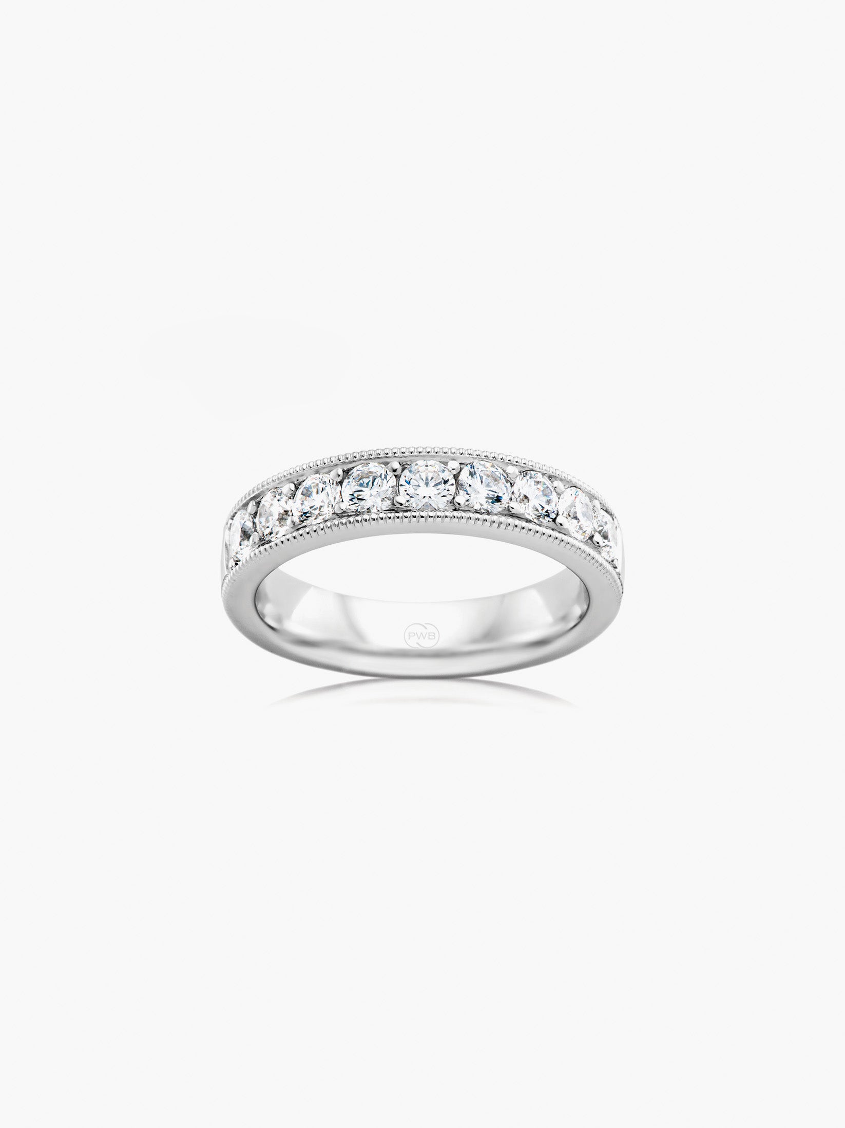 This statement milgrain diamond wedding ring features a bold band profile adorned with brilliant diamonds and intricate milgrain detailing. Each Orsini wedding ring is crafted to order, allowing you to personalise the design in your preferred metal, width, thickness, and finger size.