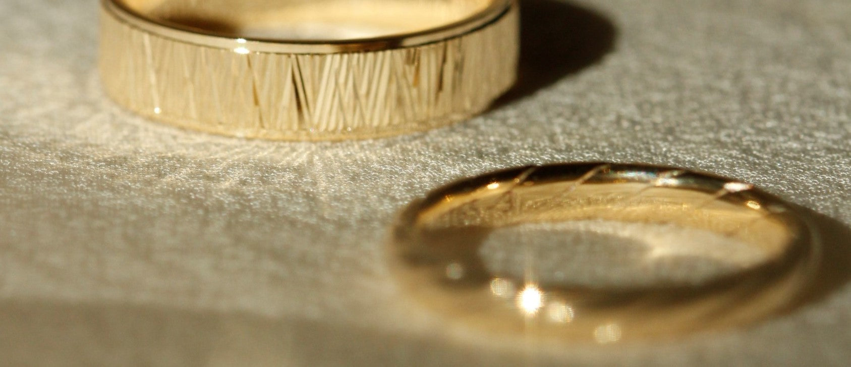 Two Yellow Gold Wedding Rings, one women's and one men's wedding ring made of yellow gold