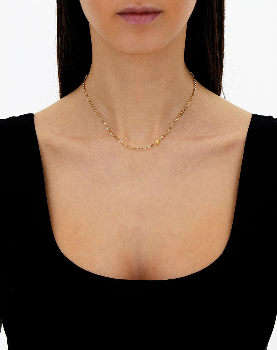 boule short gold neckalce on model