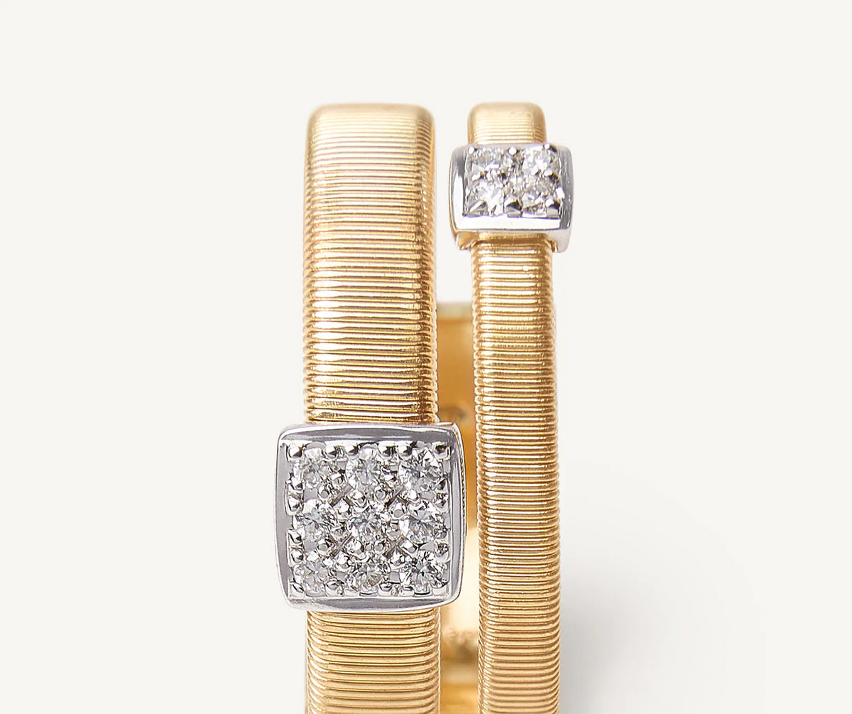 Close up of diamond pave ring set in yellow and white gold 