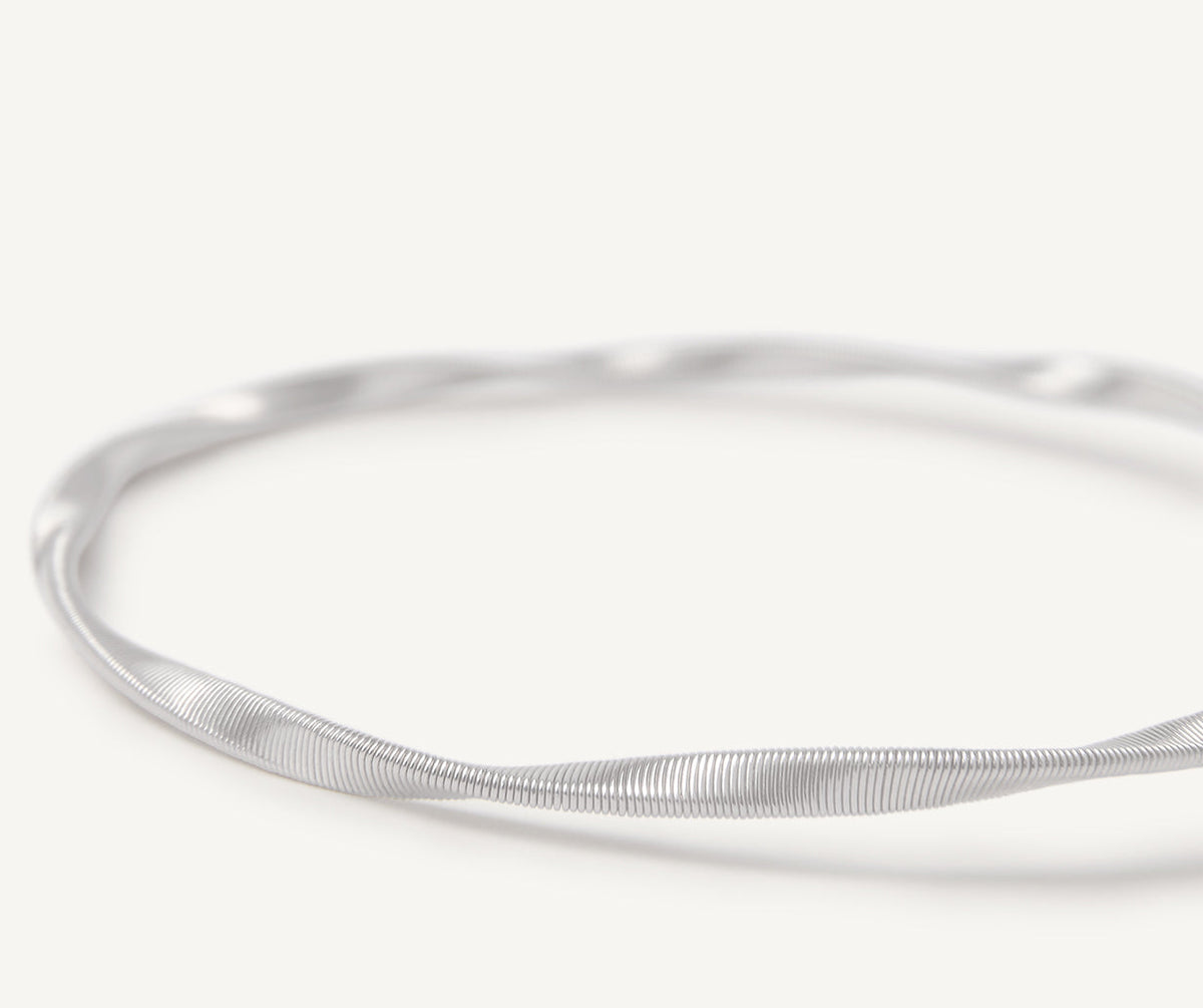 Close up 18k white gold one strand bracelet by Marco Bicego