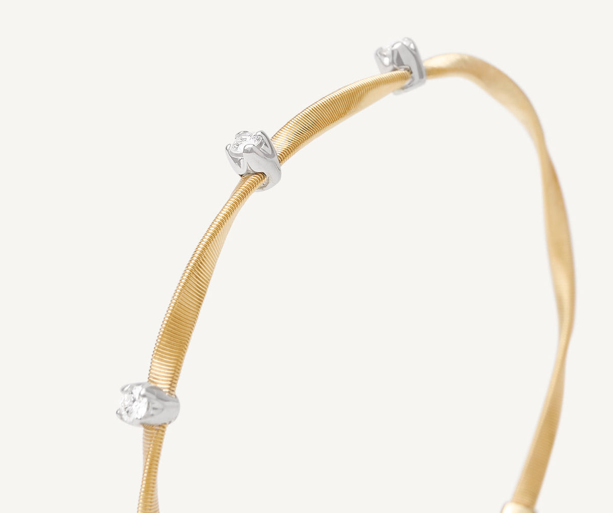 Close up image of Marco Bicego one strand marrakech bracelet in 18k yellow gold