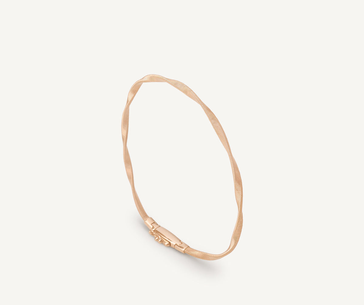 Rose gold one strand Marrakech bracelet by Marco Bicego on white background