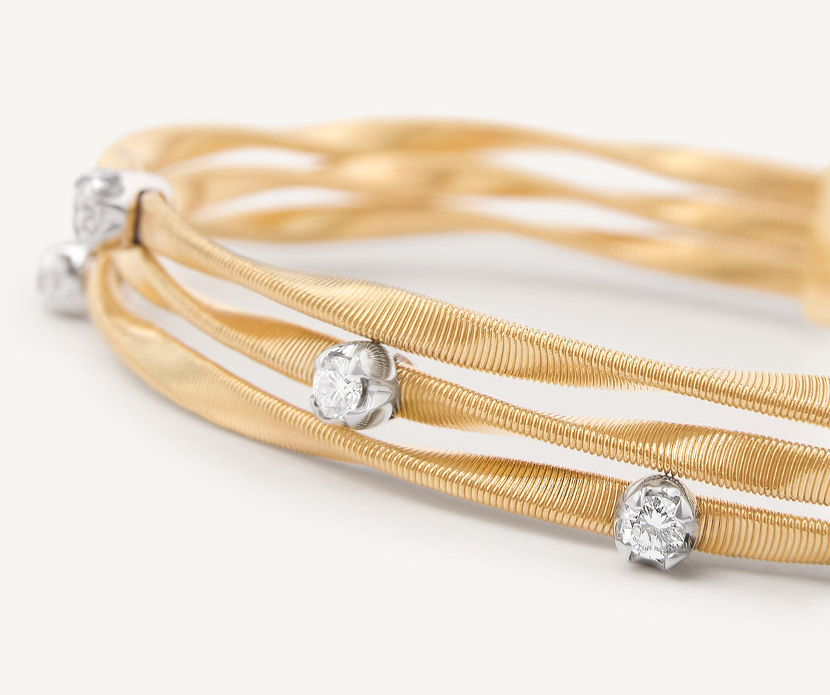 Three strand yellow gold and diamonds bracelet by Marco Bicego Marrakech collection