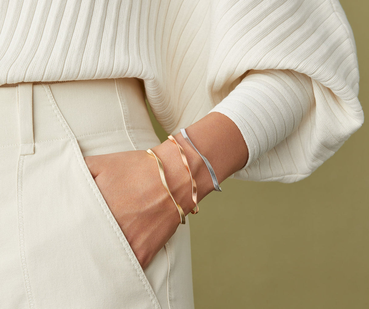 Marco Bicego Marrakech bracelet in white, rose and yellow gold all worn together. 