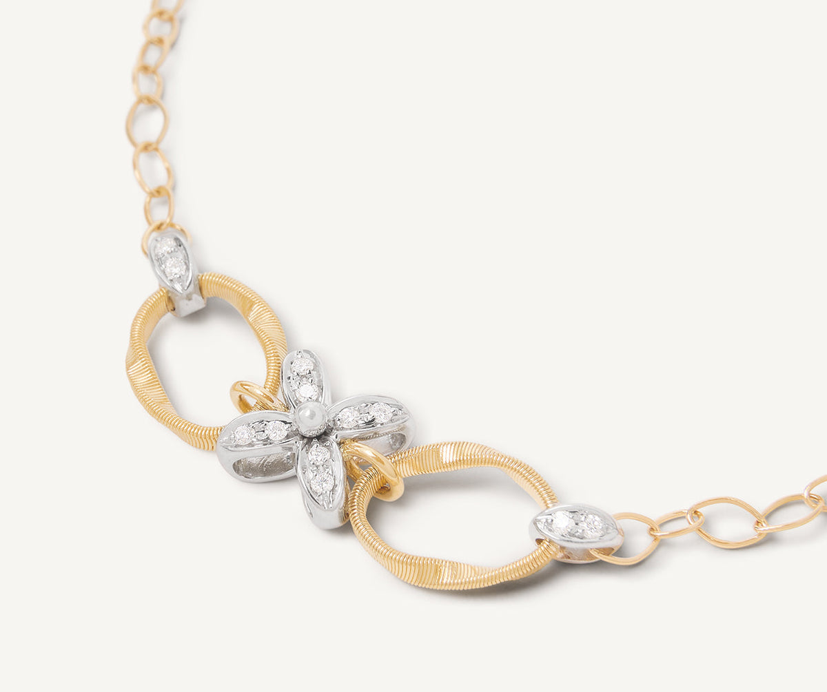 Close up of diamond flower on Marrakech Onde bracelet in yellow gold by Marco Bicego