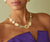 18k yellow gold lardge Lunaria necklace worn with Lunaria hoops by Marco Bicego