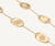 Close up of Lunaria long necklace in 18k yellow gold designed by Marco Bicego