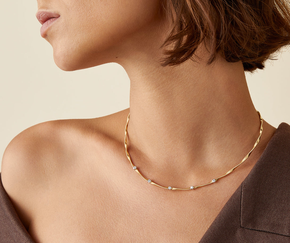 Marco Bicego Marrakech necklace worn on model in 18k yellow gold with diamonds