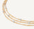 Close up of Marrakech necklace three strand 18k yellow gold with diamonds necklace