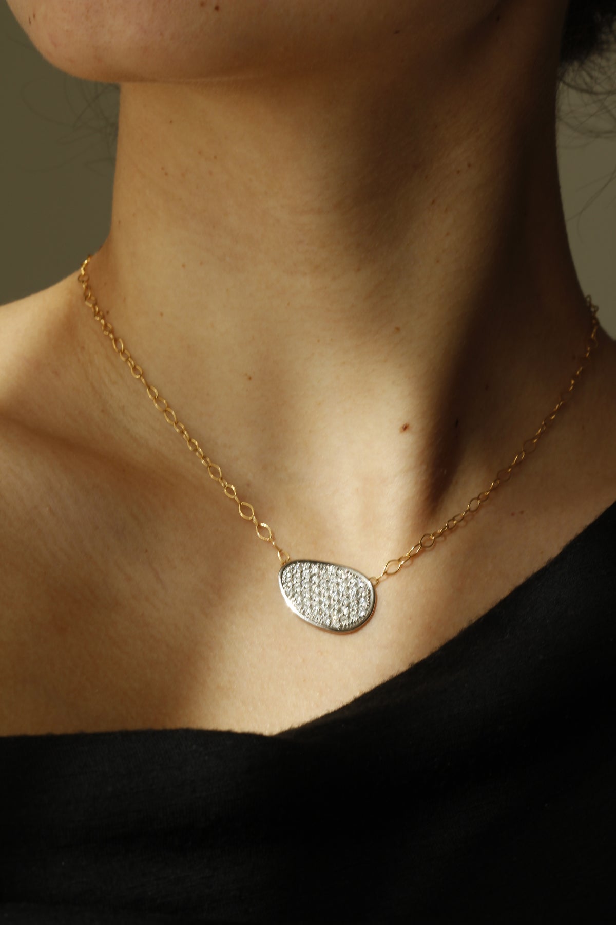 Lunaria necklace in diamonds set in white gold with yellow gold chain 