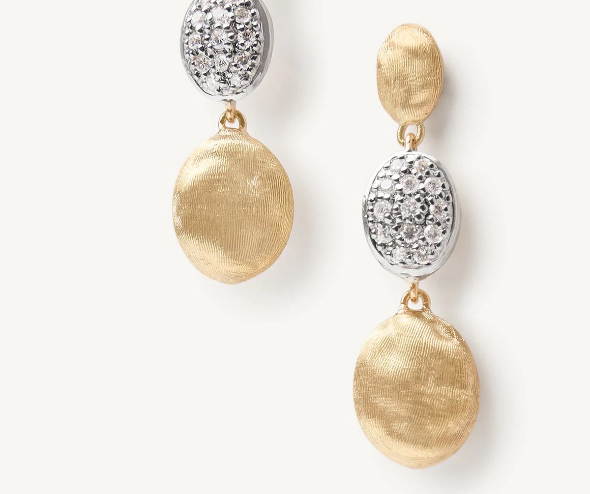 Close up of Siviglia stud earrings in yellow gold with diamonds