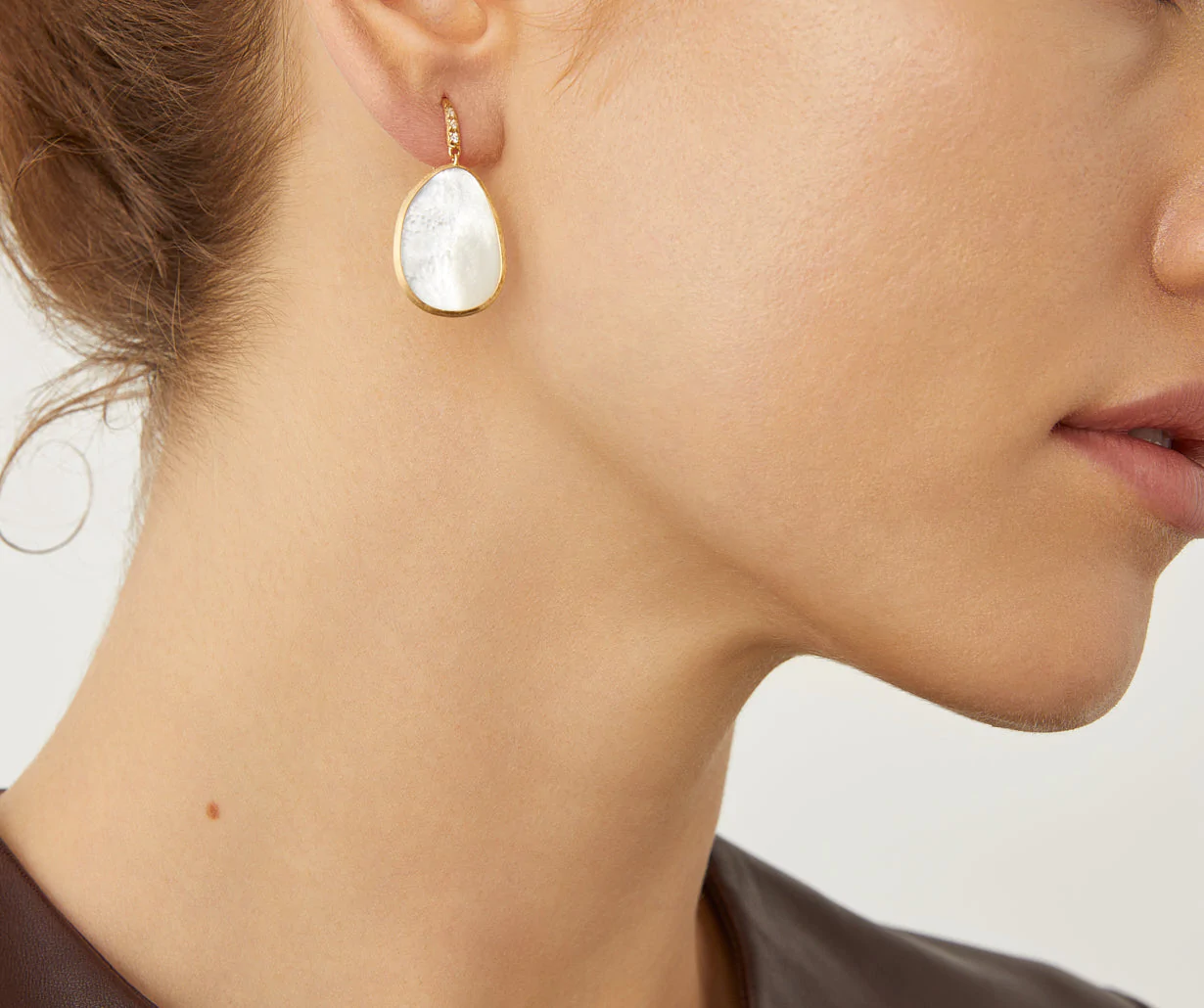 Close up of Lunaria drop earrings by Marco Bicego 