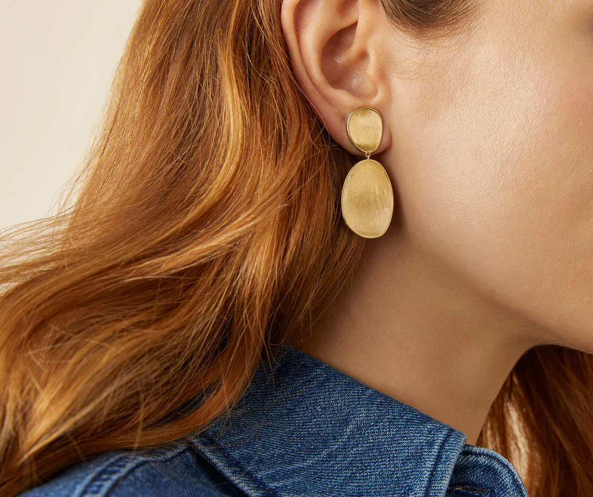 Yellow gold Lunaria drop earrings worn 
