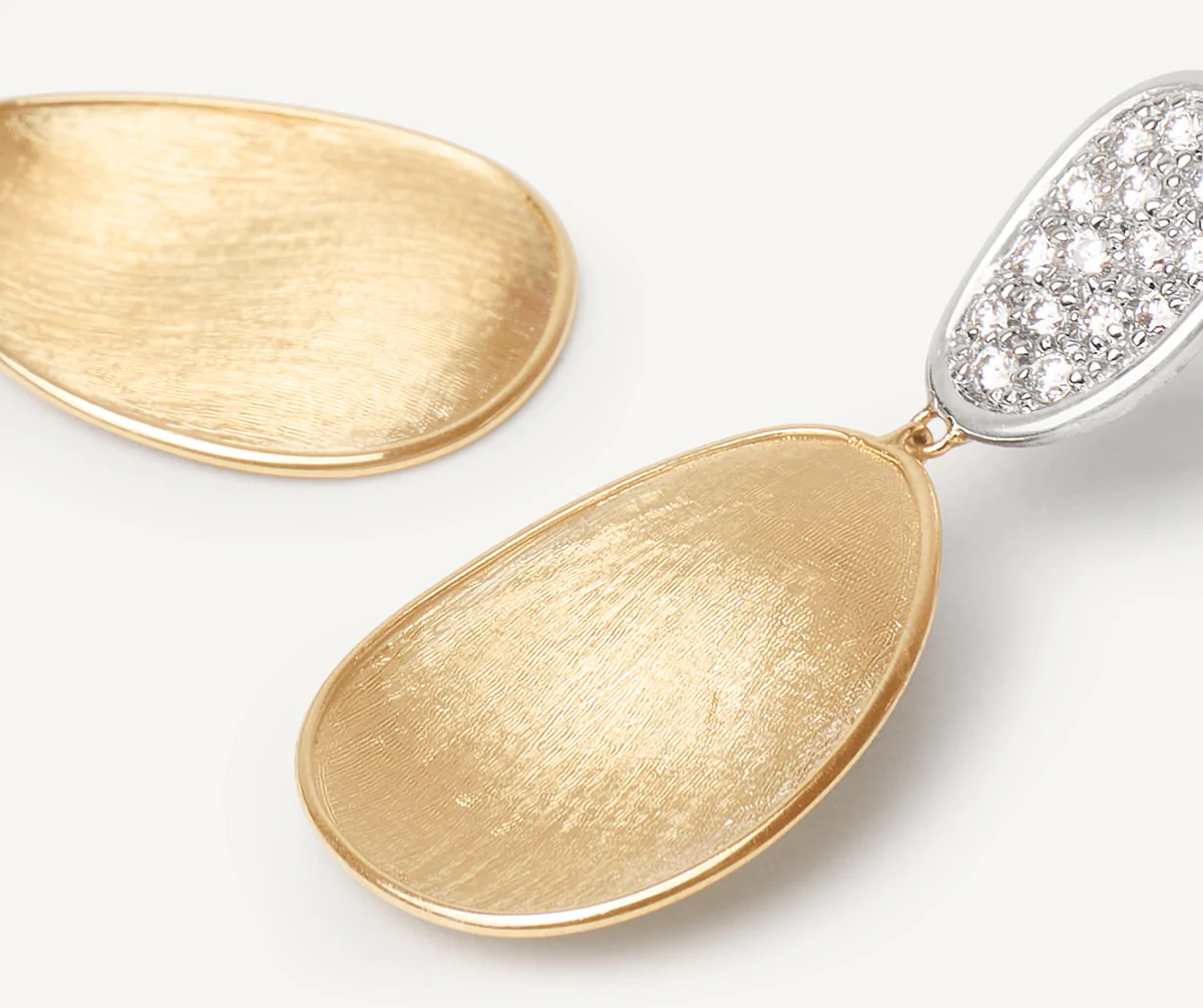 Close up of Lunaria drop earring in yellow and white gold with diamonds 