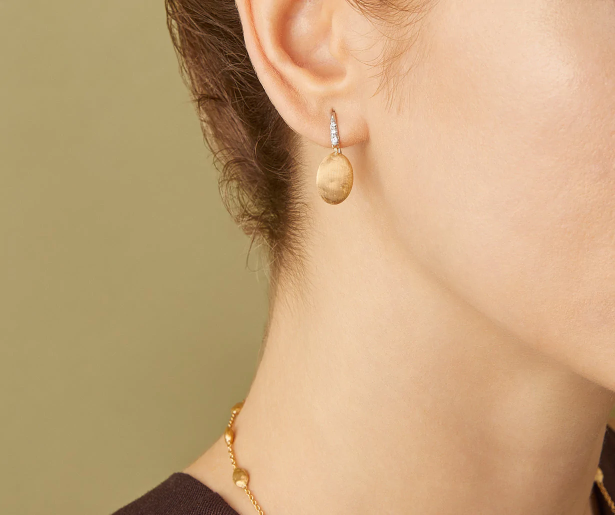 Side view of Siviglia white gold with diamonds and yellow gold handmade in Italy by Marco Bicego