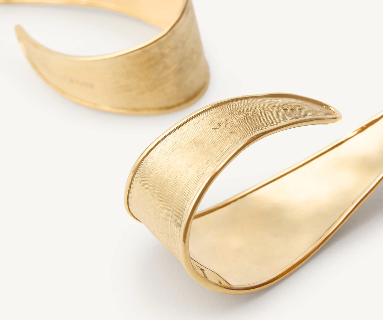 Close up of Lunaria hoop earrings in yellow gold by Marco Bicego 